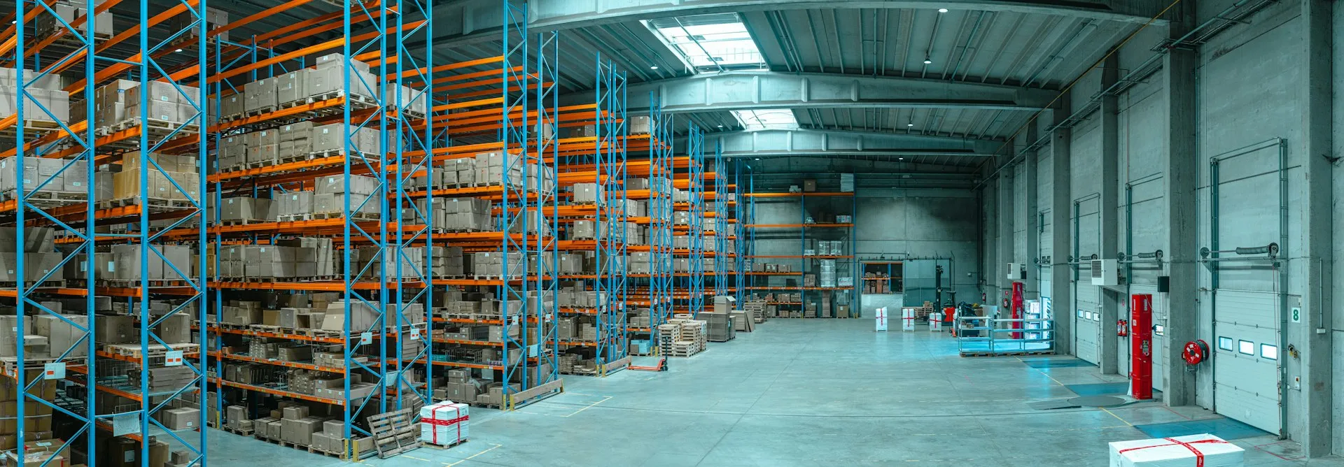 Tall warehouse shelving stocked with palletised goods